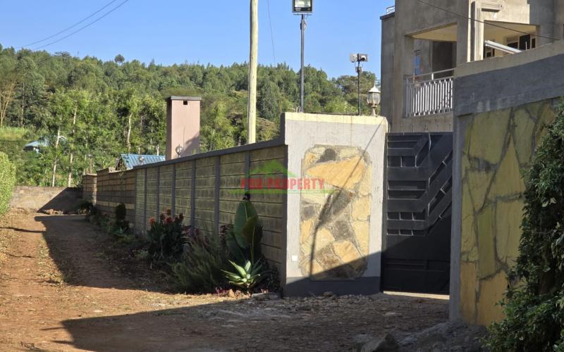 Prime 100x100ft Residential Plot for Sale in a Secure Gated Community – Just 50m from Tarmac and police station